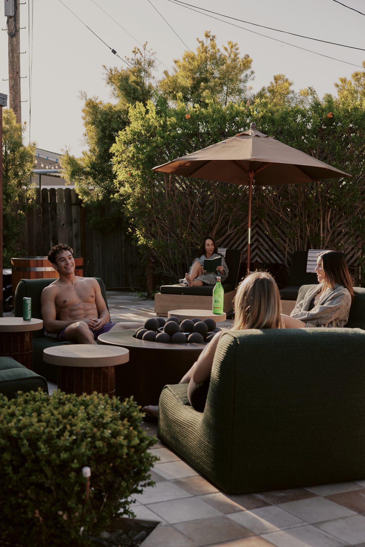 Guests gathered around the fire in the Wren garden